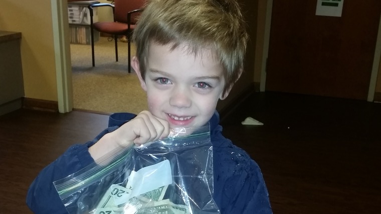 Boy makes donation to preschool teacher