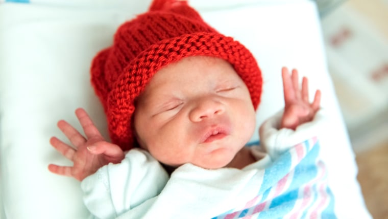 Babies in red caps