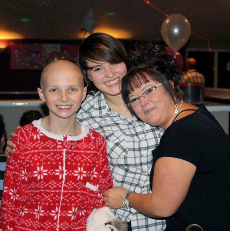 Emma with big sister Danni and their mom Cheryl.
