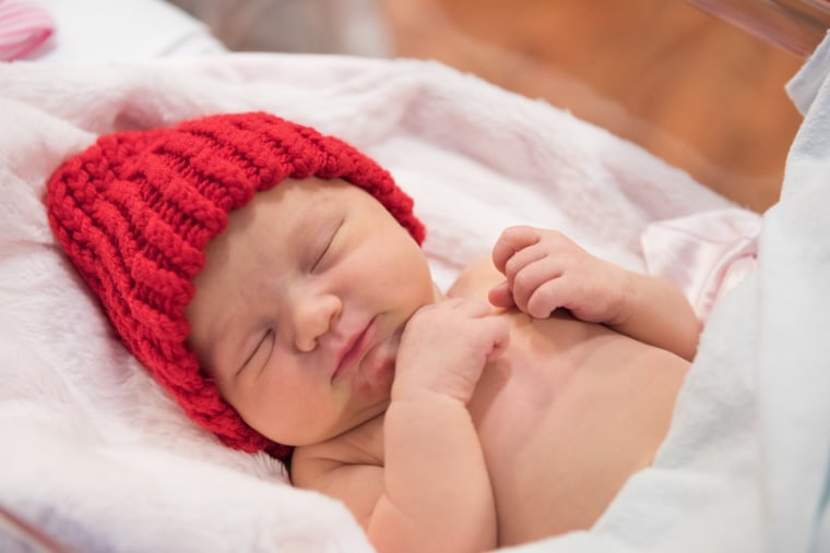 Many babies born in February are receiving red caps as part of the “Little Hats, Big Hearts” project, which draws attention to heart disease.