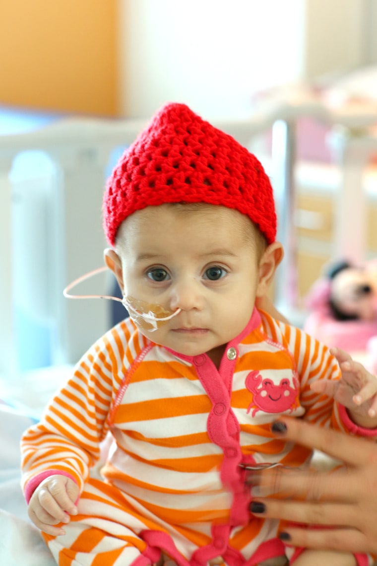 Many babies born in February are receiving red caps as part of the “Little Hats, Big Hearts” project, which draws attention to heart disease.