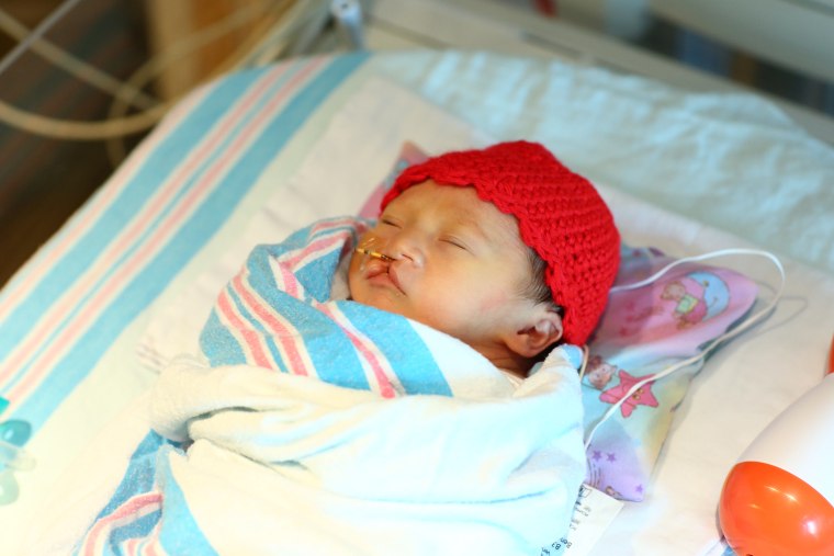 Many babies born in February are receiving red caps as part of the “Little Hats, Big Hearts” project, which draws attention to heart disease.