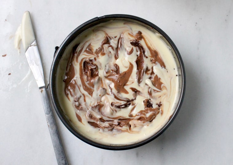 Slow Cooker Marble Cheesecake: Using a table knife, make a few swirls through the batter to create a marble effect. Don't swirl too many times.