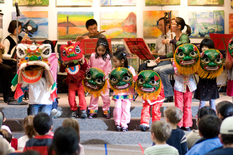 Chinese Lunar New Year presentation and lion dance performance w Ann Arbor Chinese Center of Michigan lion dance team at the Ann Arbor District Library, downtown branch, in Ann Arbor, Michigan.