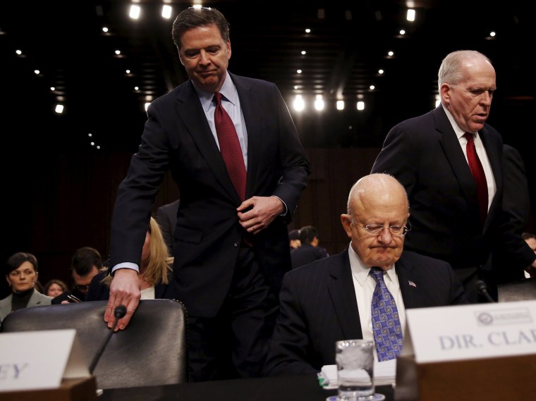 Image: FBI Director James Comey, Director of National Intelligence James Clapper and CIA Director John Brennan