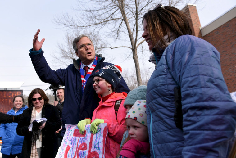 Image: U.S. Republican presidential candidate, Governor Jeb Bush meets the Quigly family of Manchester; Charley, 11, Ellie, 7, Tula, 5 and mom, Chris Quigley while stopping at the Manchester precinct, Webster Elementary School in Manchester