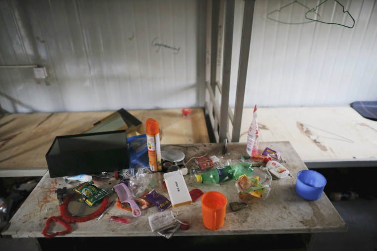 Image: Possessions of a migrant worker are seen at his accommodation at the construction site of Zixia Garden development complex in Qianan, Tangshan City