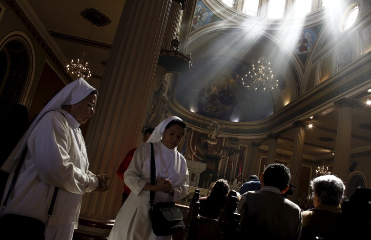 Image: Nuns attend a mass during the traditional Ash Wednesday service, at the Metropolitan Cathedral in San Jose