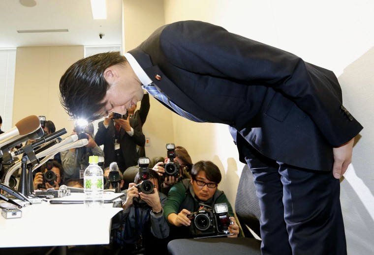 Image: Kensuke Miyazaki bows Friday during a news conference about his affair.