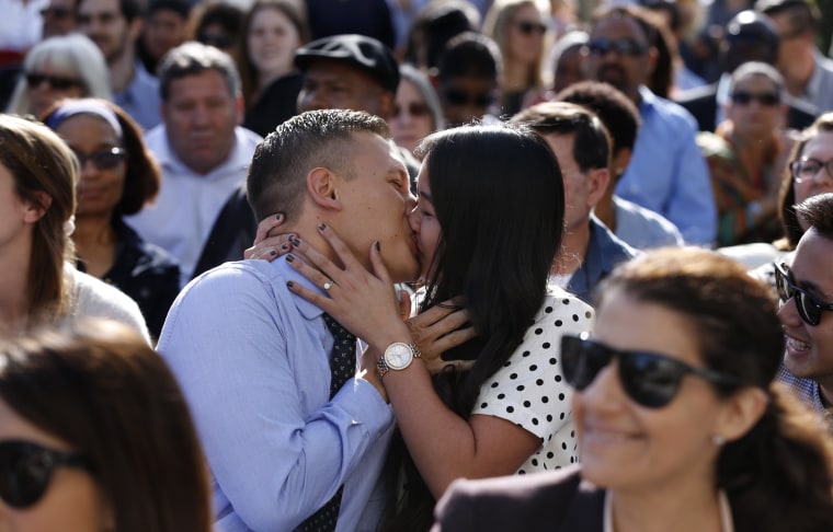 Image: Married medical students kiss after matching with hospitals in March 2015 in Irvine, Calif.