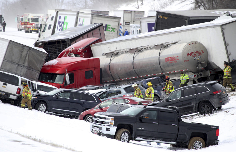 Image: Emergency personnel work at the scene of a crash near Fredericksburg, Pa.