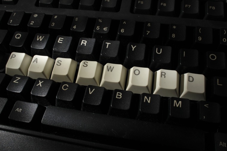 Image: Computer keyboard with letters stacked forming the word 'password'