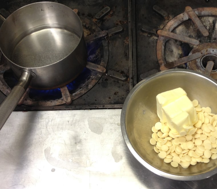 Molten Maple Lava Cakes: In a double boiler, over simmering water, melt the butter with the white chocolate