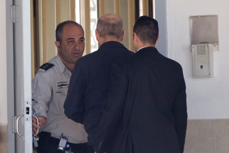 Image: Ehud Olmert enters prison