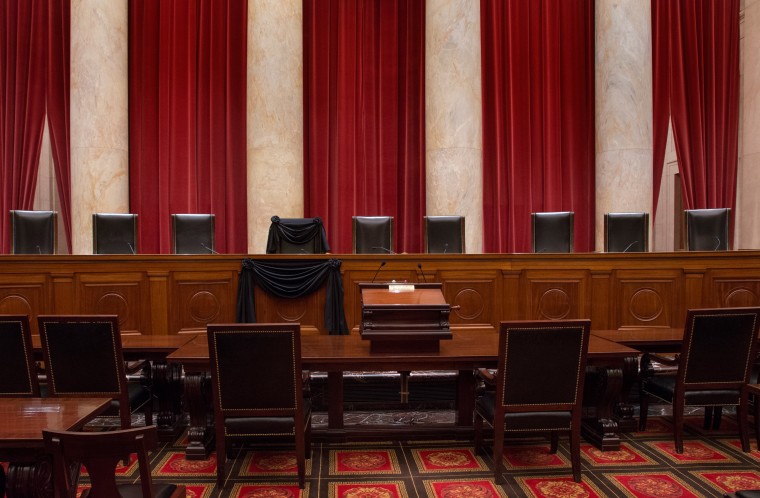 Image: The Courtroom of the Supreme Court showing Associate Justice Antonin Scalia’s Bench Chair and the Bench in front of his seat draped in black following his death on Feb. 13, 2016.