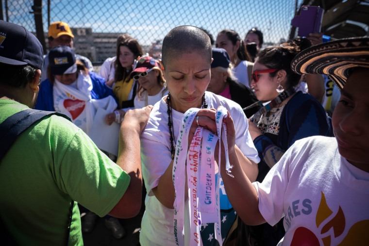 As they made their way across the border, the women stopped to tie ribbons with names of immigrants on barbed wire fences.