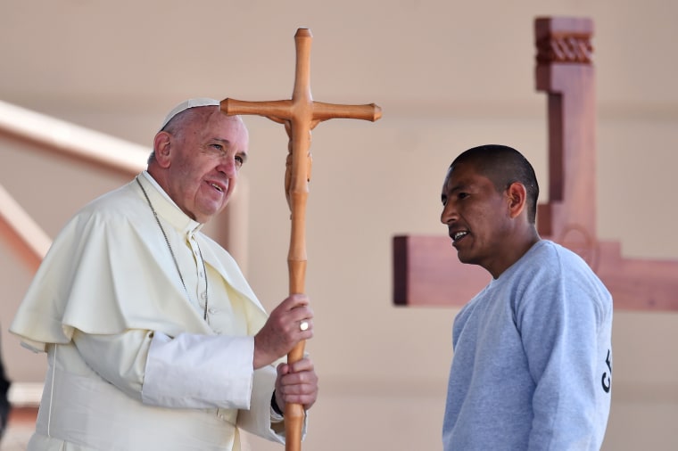 Image: Pope Francis receives a cross made by an inmate during his visit to the CeReSo n. 3 penitentiary