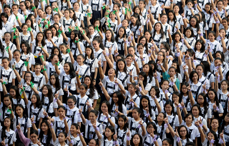 Image: Students participate in a girls empowerment campaign in Manila