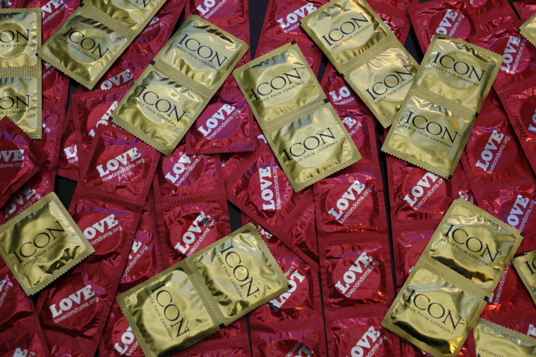 A sample of condoms distributed freely by the AIDS Healthcare Foundation in 28 countries is displayed at a news conference at the AHF headquarters in Los Angeles. 