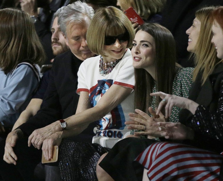 Image: Vogue editor Anna Wintour, second from left, waits for the start of the Marc Jacobs Fall 2016 collection