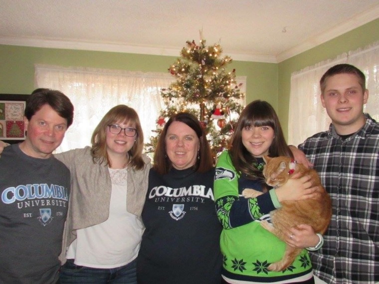 Cathy Forinash, center, with her husband Greg, left, and their three children, Madeline, 25; Caitlin, 23; and Simon, 18.