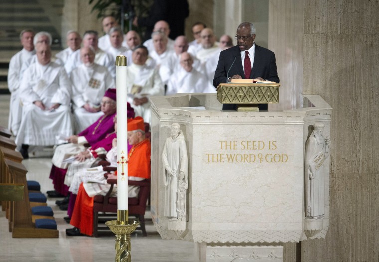 Image: Justice Clarence Thomas reads during the funeral Mass for Justice Antonin Scalia