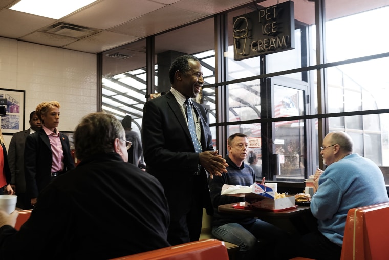 Image: Republican presidential candidate Ben Carson visits voters