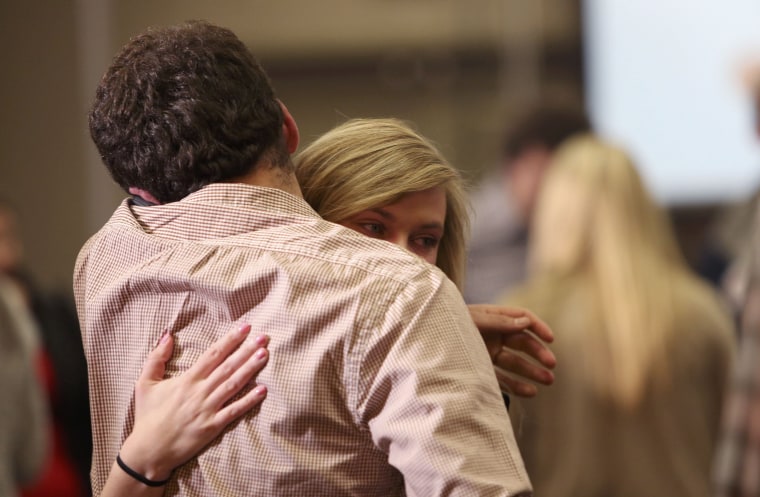 Image: Supporters of Republican presidential candidate Jeb Bush console each other after Bush abandoned his quest for the White House and suspended his presidential campaign at his South Carolina primary night party in Columbia
