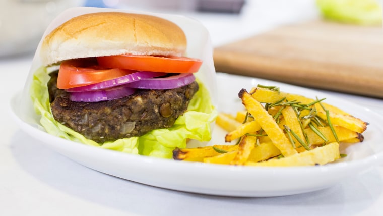 Siri Daly cooks up a healthy meal of veggie burgers and rutabaga fries