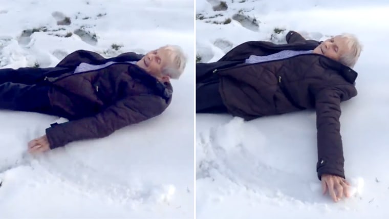 Woman makes a snow angel for her 85th birthday