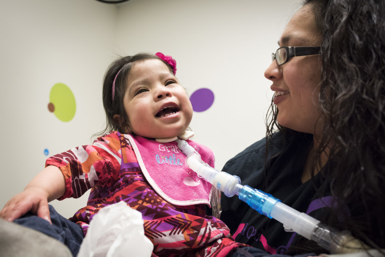 Adeline Mata shares a laugh with mom Elysse during a clinic appointment.