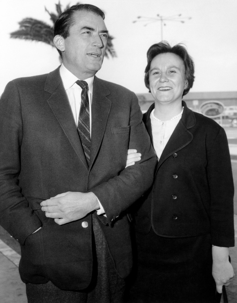 Harper Lee arrives with actor Gregory Peck at a 1962 event for the film adaptation of her novel.