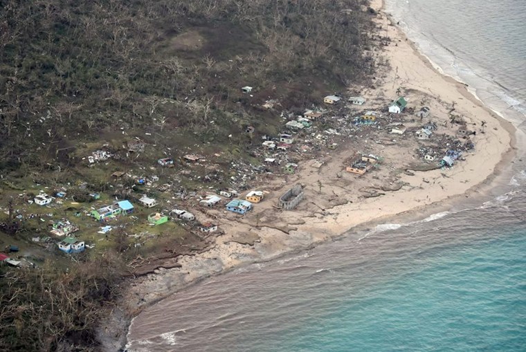 Image: A handout aerial picture taken by the Air New Zealand defense force shows the damage around Tavua on the main Fiji island of Viti Levu.