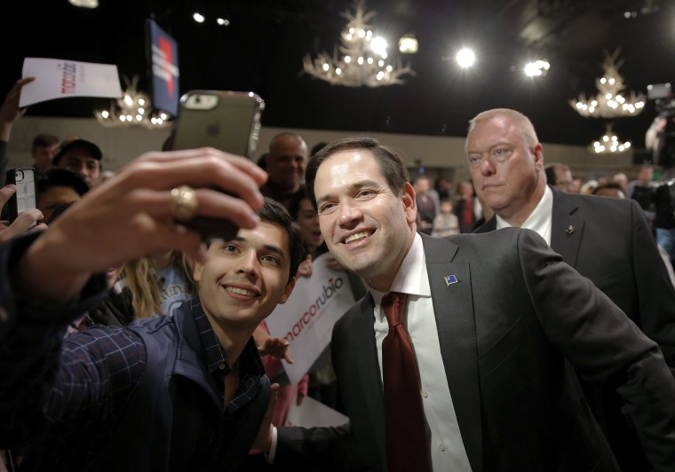 Image: Marco Rubio poses for a photo with a supporter