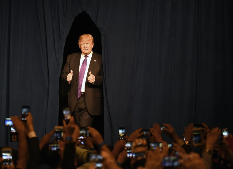 Image: Donald Trump arrives at a caucus night watch party