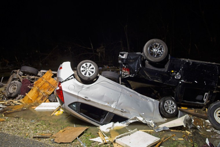 Image: Destroyed trailers and vehicles at park lay strewn across the park