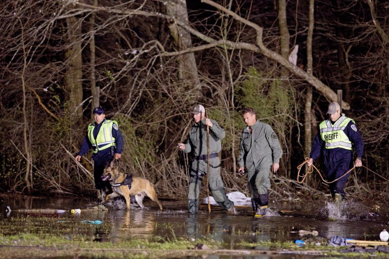Image: Search and rescue teams slog through the remains of the park
