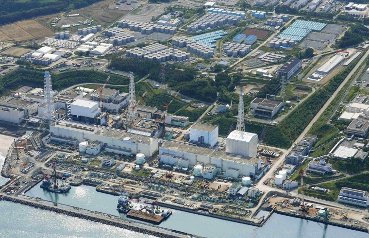 Image: Aerial view of TEPCO's tsunami-crippled Fukushima Daiichi nuclear power plant and its contaminated water storage tanks in Fukushima