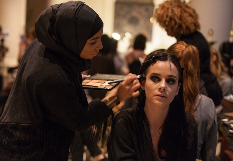 A model gets her makeup done before the fashion show benefiting Freedom Ladder, a non-profit organization aiming to prevent human trafficking.