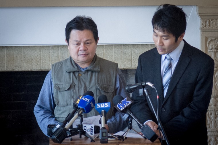 Aniwat Khadphab speaks at a press conference announcing the launch of the API Human Trafficking Task Force about his experience being trafficked at farms in Hawaii and Washington. On his right is Phatchara Udomsin, a Thai CDC attorney and translator.