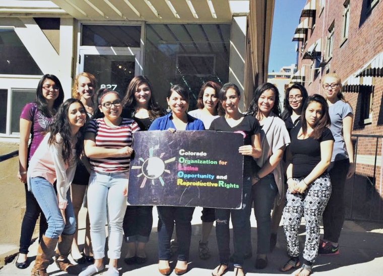 Aguilar in front of the COLOR 'casita' (little house) with the Spring 2015 Latinas Increasing Strength (LIPS) Cohort.