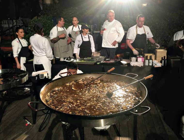 Acclaimed chef Jose Andrés makes a paella at the start of the South Beach Wine and Food Festival in Miami, on Thursday, Feb. 25, 2016.