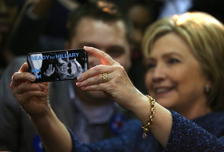 Image: Clinton takes a selfie with a supporter