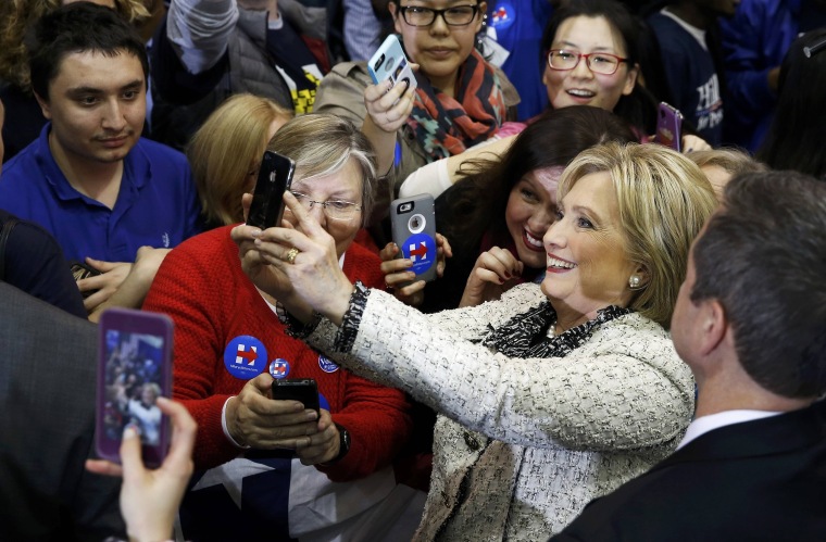 Image: Clinton takes a selfie with supporters during a primary night party in Columbia