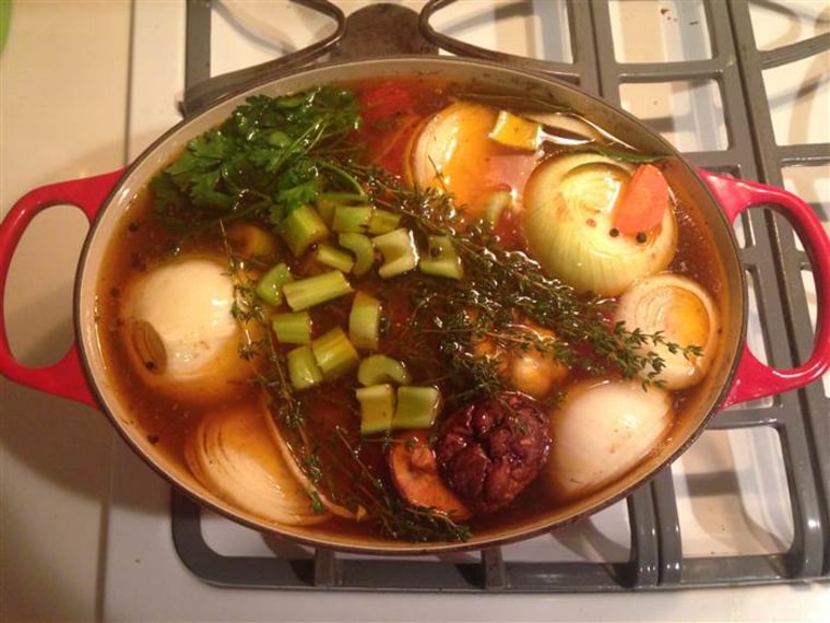 A batch of bone broth simmering on the stove