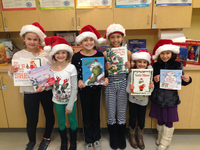 A group of the Book Buddies pose at a holiday event.