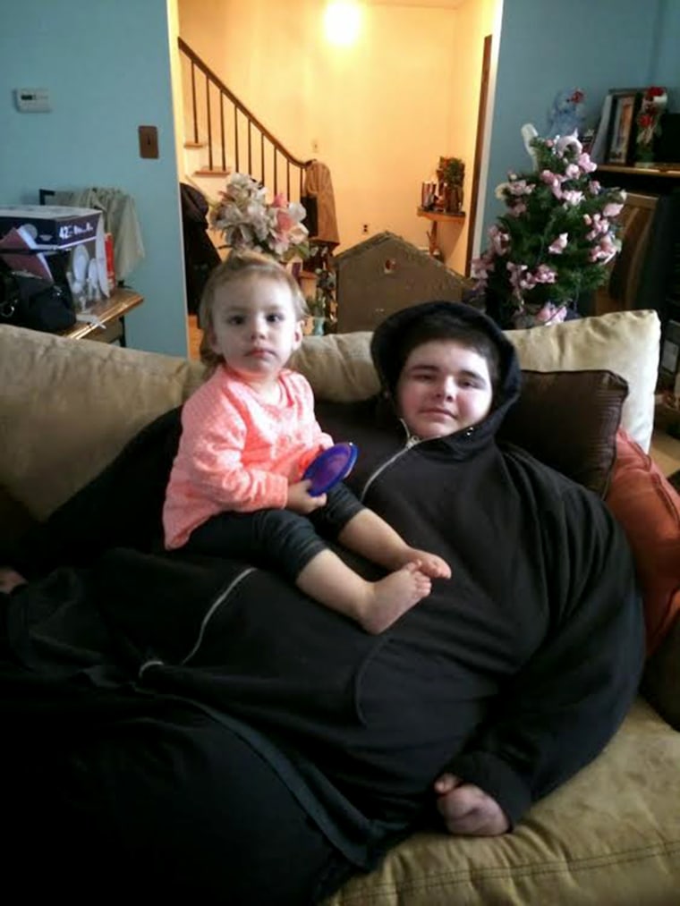 Chris Charron, with his cousin Amelia Almond, before losing 325 pounds.