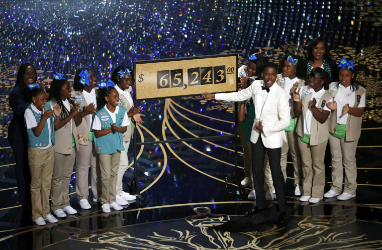 Image: Show host Chris Rock reveals that $65,243.00 was raised when Girls Scouts sold cookies to the Oscars audience at the 88th Academy Awards in Hollywood