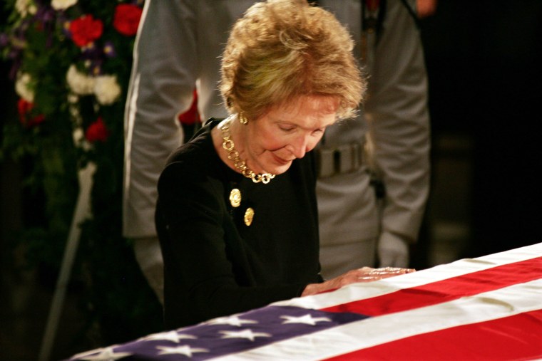 Nancy Reagan Touches The Flag-Draped Casket Of Her Husband Ronald Reagan As He Lies In State In The Capitol Rotunda