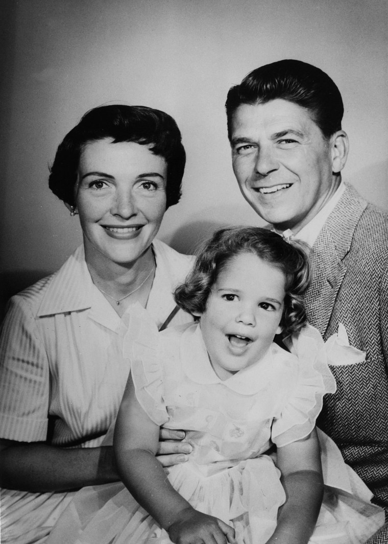 Stage and Screen, (Politics) Personalities. USA. pic: May 1957. Voted \"Screen Father of the Year\" Ronald Reagan with his wife Nancy and daughter Patti. Ronald Reagan (born 1911) became the 40th President of the United States serving 1981-1989.